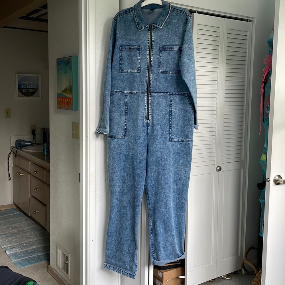 Acid washed stretch denim coveralls.